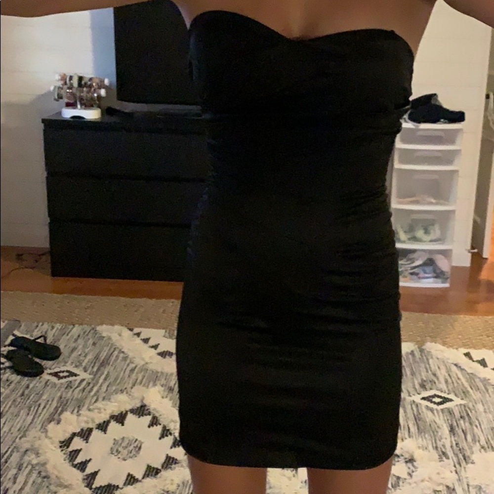 Strapless (or strapped) black satin dress